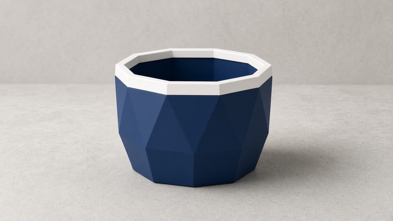 Blue geometric planter with white interior rim